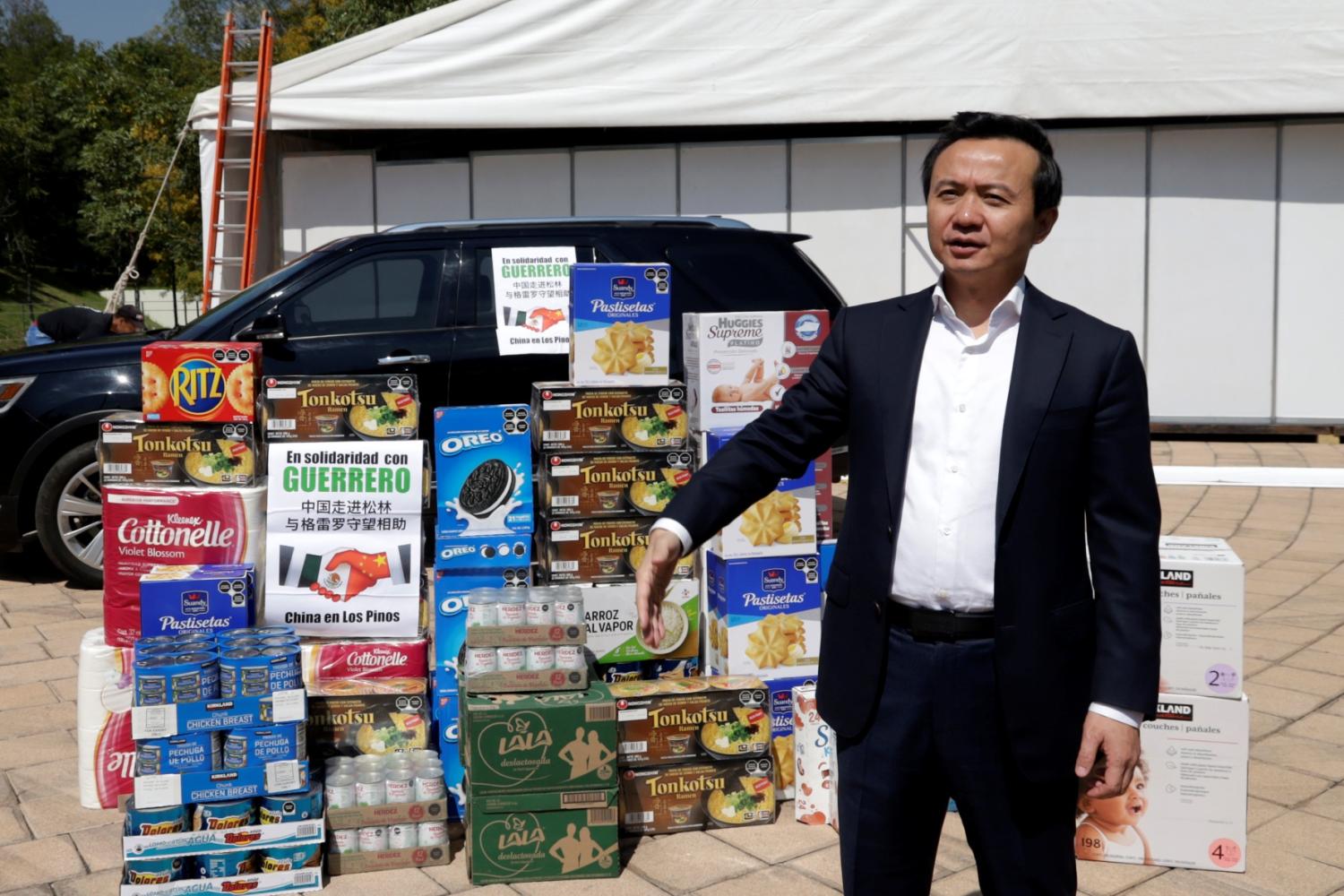 China's ambassador to Mexico, Zhang Run, donates food for those affected by Hurricane Otis in Mexico City on October 25, 2023.